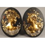 Pair of oval Art Nouveau gilt metal figure bust wall plaques, (possibly Glasgow School)60 cm