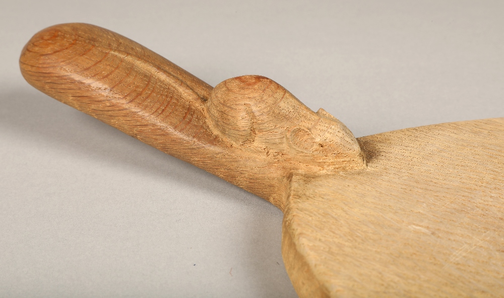 Robert Thompson of Kilburn (1876-1955), "Mouseman", carved oak cheese board with short handle, - Image 2 of 2