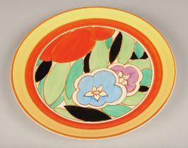 Clarice Cliff Fantasque Bizarre wall charger, decorated in bright colours, diameter 34cm.