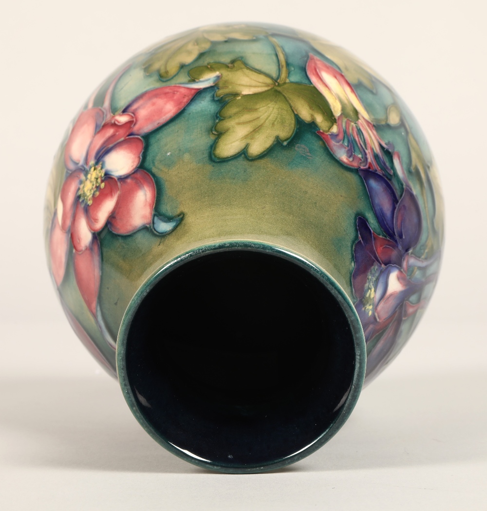 Moorcroft pottery vase of baluster form, green/blue ground in the clematis pattern, signed in blue - Image 7 of 13