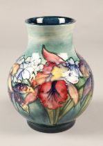 Moorcroft pottery vase in the Orchid pattern, 20cm high.