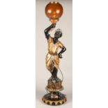 Blackamoor figure converted in to a lamp, depicting a lady in golden robes holding a lamp, 97 cm