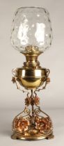 Oil lamp with copper and brass foliate decoration on the base, 62 cm high including glass shade