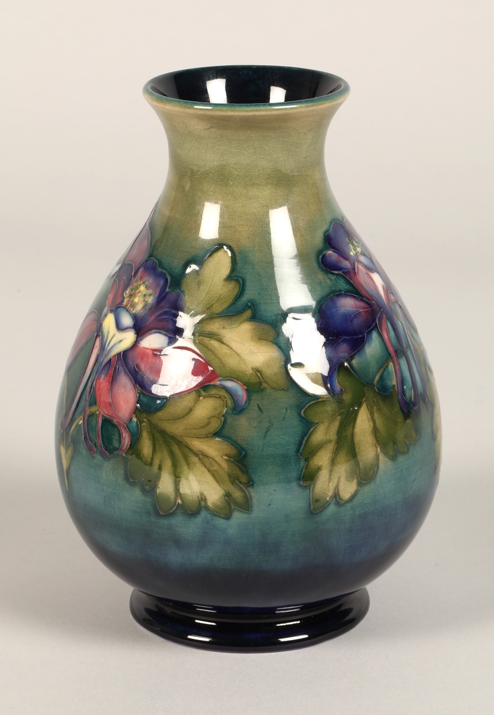 Moorcroft pottery vase of baluster form, green/blue ground in the clematis pattern, signed in blue - Image 3 of 13