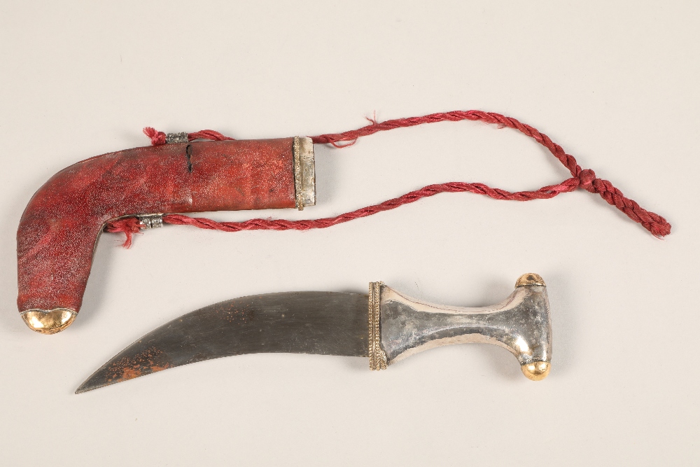 A Middle Eastern Omani white metal mounted Jambiya dagger, with gilt enrichments and engraved - Image 3 of 4