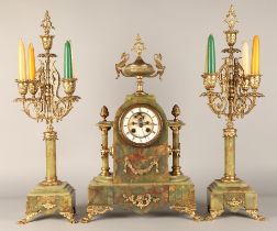 Three piece garniture clock set, by Brysons, Paris, 50cm high.
