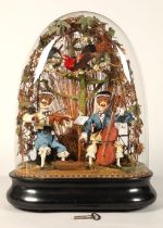 An antique musical automaton under a glass dome, two monkey musicians, a violinist, and a cello