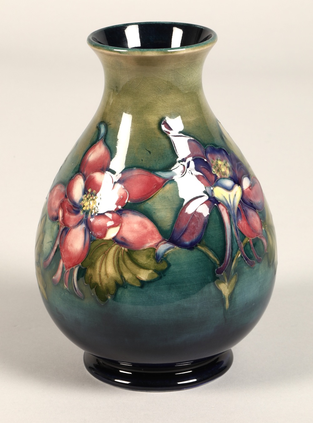 Moorcroft pottery vase of baluster form, green/blue ground in the clematis pattern, signed in blue - Image 12 of 13
