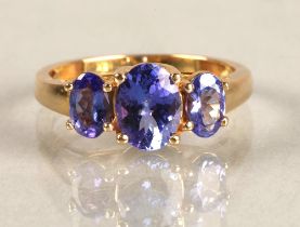 Ladies 18ct yellow gold three stone tanzanite ring, ring size M.