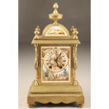 19th century French brass mantle clock, porcelain dial with hand painted courting couple, black