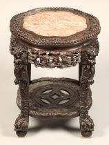 Chinese hardwood jardiniere stand with rouge marble top, Wyllie Lochhead label, with carved apron,