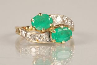 Ladies Emerald and Diamond ring, two oval cut emeralds in twist setting with four graduated diamonds