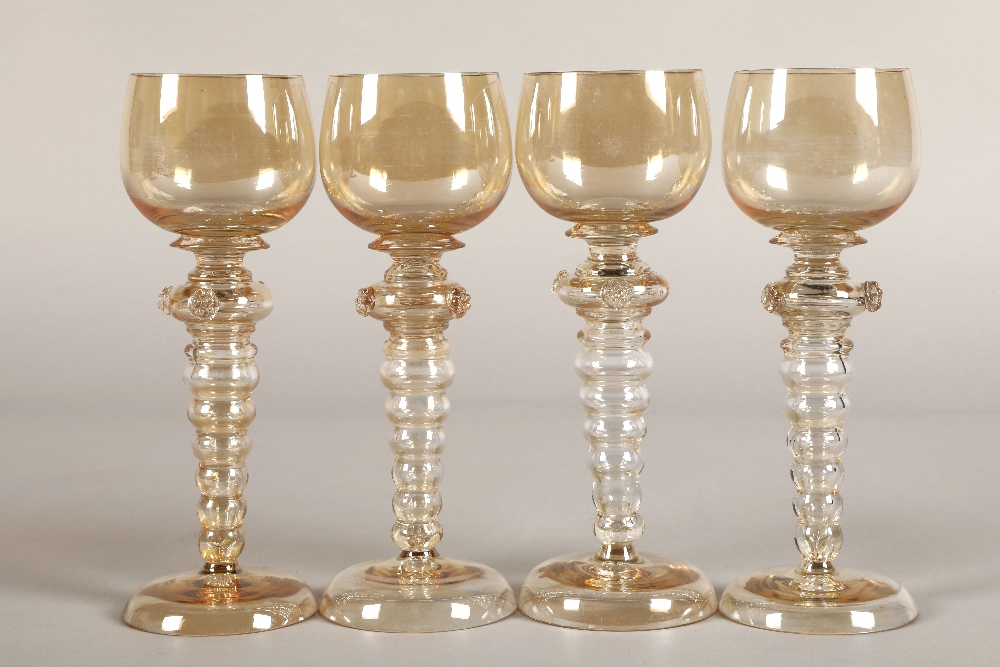 Set of four hock glasses with bubble glass stems 19.5cm high.