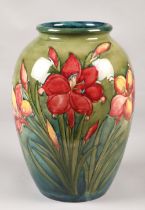 Large Moorcroft pottery vase in the hibiscus pattern, (some damage) 33cm high.