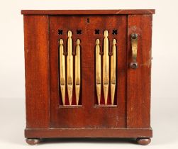 A 19th century miniature chamber barrel organ, playing eight tunes on twelve keys with one rank of