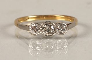 Ladies 18ct gold three stone diamond ring set in platinum mount, ring size O.