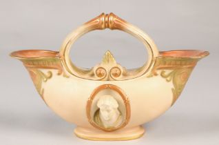 Royal Worcester double ended flower basket with oval relief mask panels in the classical style, 19cm