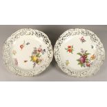 Pair of Dresden style wall chargers, hand painted with flowers, fruit and vegetables, with pierced