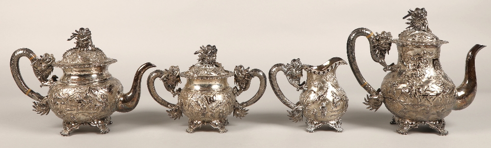 Fantastic 19th century chinese silver four piece tea and coffee service, decorated with warriors,