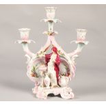 Continental school candelabra, with cross sword markings, featuring classical figures with fire,