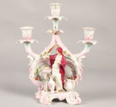 Continental school candelabra, with cross sword markings, featuring classical figures with fire,
