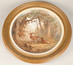 Continental hand painted ceramic wall charger, framed, "Deer in Woodland" indistinctly signed,