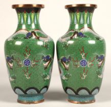 Pair of Japanese cloisonne vases, green ground with coiled dragon, 23cm high.