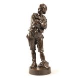 After Anton Nelson (French 1880-1910) 'Defi' bronze figure of a boy with arms crossed and cap,