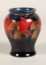 Moorcroft pottery vase of baluster form, pomegranate pattern, blue signature to base, 15cm high.