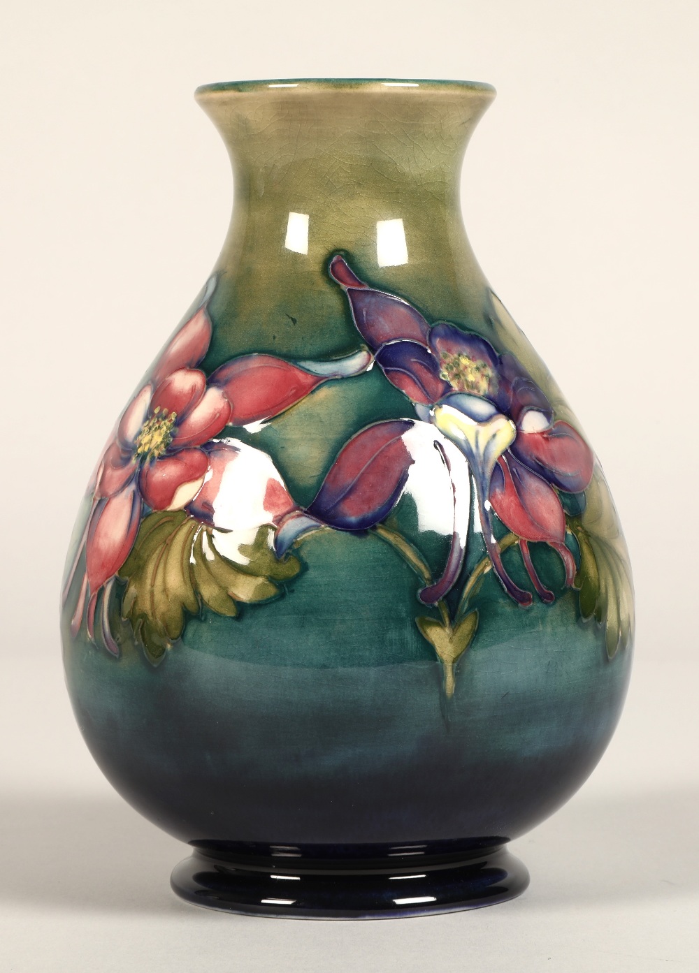 Moorcroft pottery vase of baluster form, green/blue ground in the clematis pattern, signed in blue - Image 2 of 13