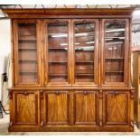 Victorian mahogany glazed four door bookcase over cupboard