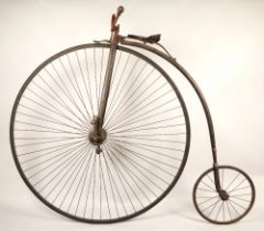 19th century penny farthing, wheel diameter 134cm, with leather seat and turned wooden handles.