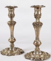 Pair of ornate Georgian silver weighted candlesticks , assay marked Sheffield 1824, maker