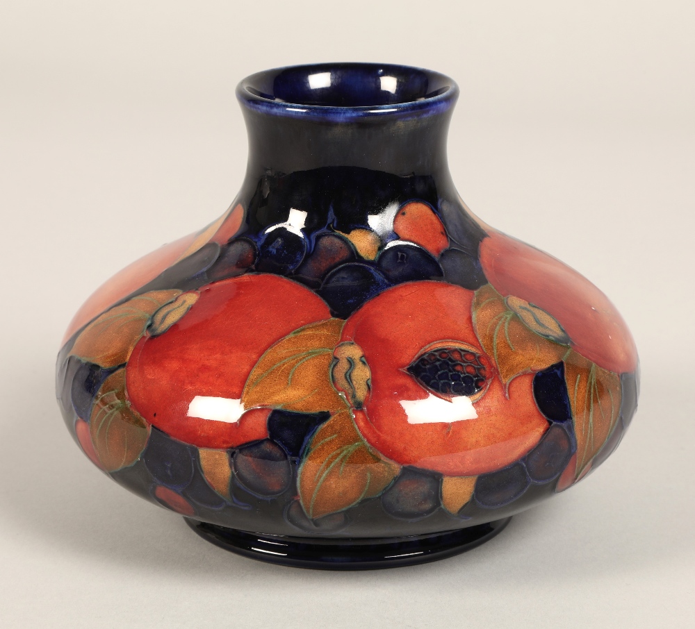 Moorcroft pottery vase, of squat form, blue ground in the pomegranate pattern, impressed mark with - Image 2 of 12