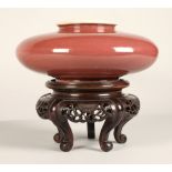 Chinese porcelain red squat vase on hardwood carved stand 10 cm high (not including stand).