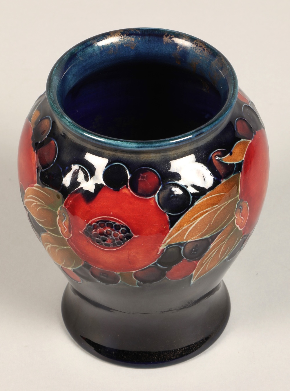 Moorcroft pottery vase of baluster form, pomegranate pattern, blue signature to base, 15cm high. - Image 6 of 9