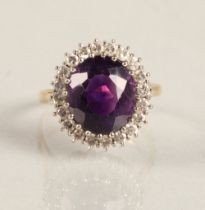 Ladies 18ct yellow gold amethyst & diamond ring, central amethyst surrounded by twenty small