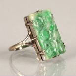 Ladies carved jade ring,mounted on white metal, ring size L/M.