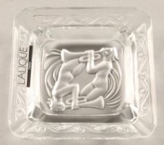 Lalique ashtray depicting two trumpeters, etched Lalique France to base, 8cm x 8cm , in Lalique box