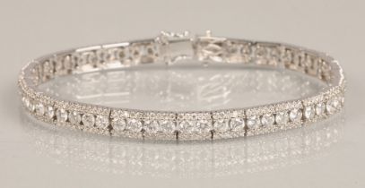 Ladies 18k white gold diamond tennis bracelet, 56 small brilliant cut diamonds with a row of smaller