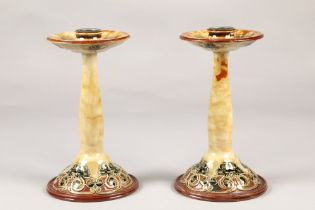 Pair of Doulton Lambeth aesthetic movement candlesticks in the liberty style, 23cm high (2)