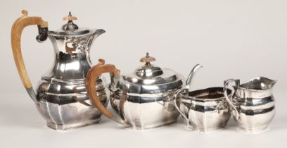 Four piece silver tea service, with hard wood stylised handles, assay marked Sheffield 1968, 1770