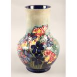 Moorcroft pottery vase, decorated in the Spring flowers pattern, impressed marks, signed in blue,