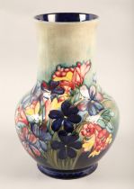 Moorcroft pottery vase, decorated in the Spring flowers pattern, impressed marks, signed in blue,