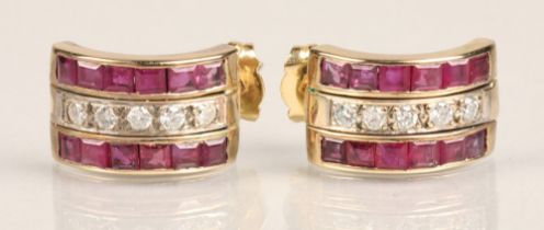 Pair of ladies 18ct yellow gold Ruby and Diamond earrings, central row of five diamonds flanked by a