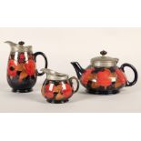 Moorcroft pottery Tudric pewter three piece tea service, pomegranate pattern designed by William