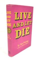 FLEMING IAN.  Live & Let Die. Dark cloth with gilt coin motif in unclipped purple d.w. by the author