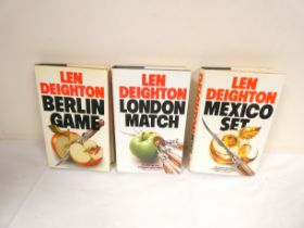DEIGHTON LEN.  1st eds. in d.w's of the trilogy -  Berlin Game, Mexico Set & London Match.