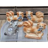 Four Bo'Ness pottery dog figures.