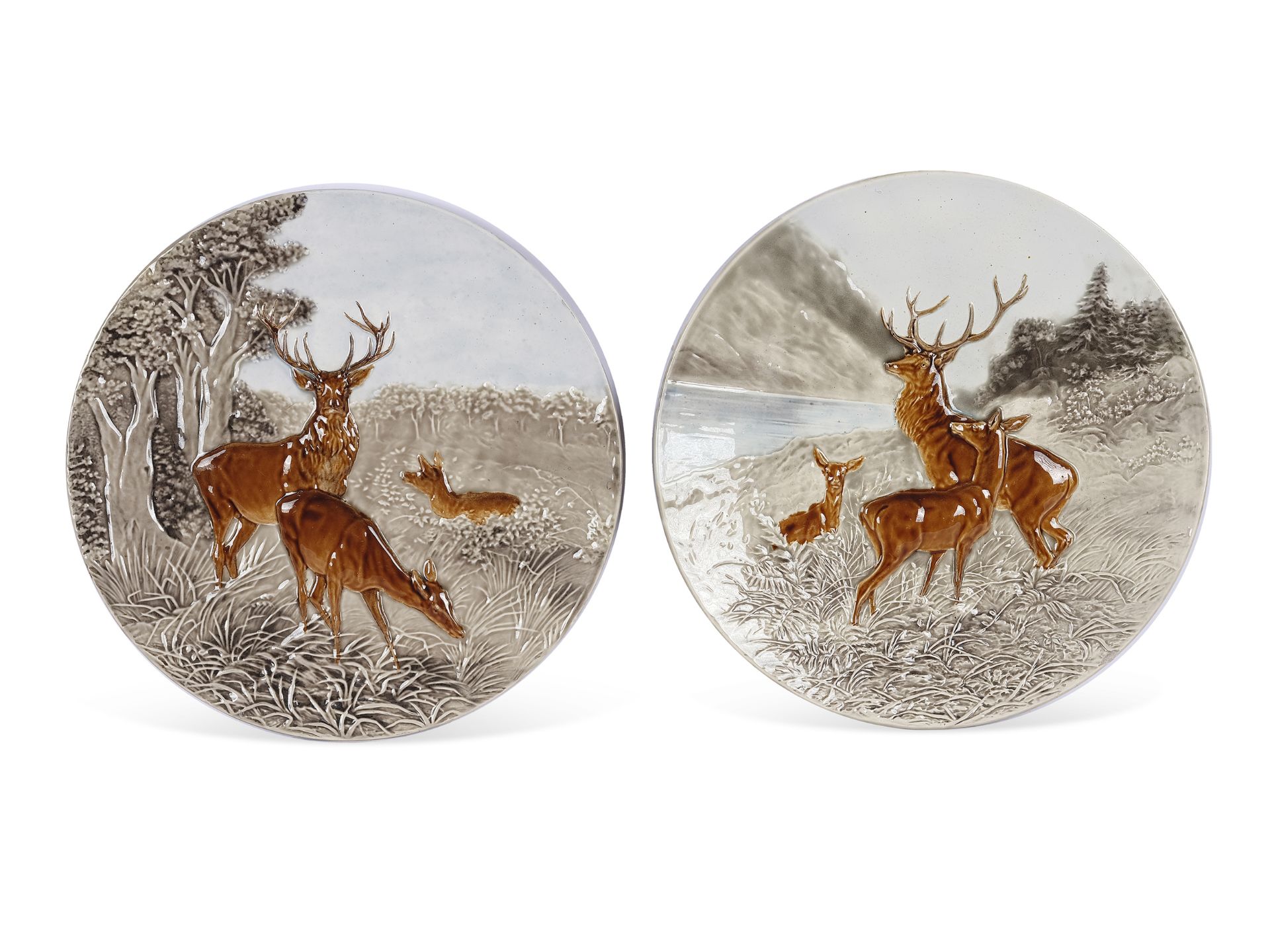 Pair of plates, relief depictions of red deer